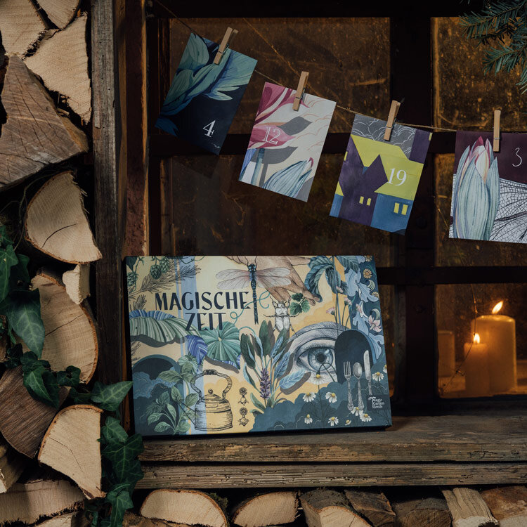 Organic seed advent calendar “Magical Time” Wondrous World of Herbs by firewood, door cards behind